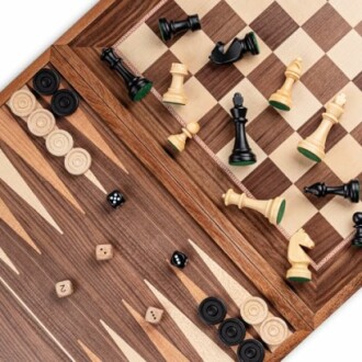 Chess and backgammon board with scattered pieces and dice.