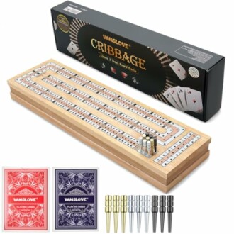 Cribbage board game set with cards and pegs.