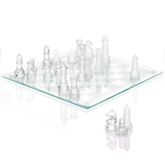 Glass chess set with clear and frosted pieces on a glass board.