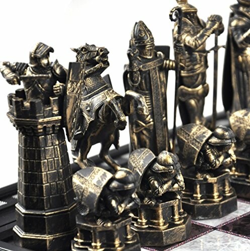 Close-up of ornate medieval-themed chess pieces.