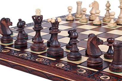 Ornate wooden chess set with detailed pieces on a carved board.