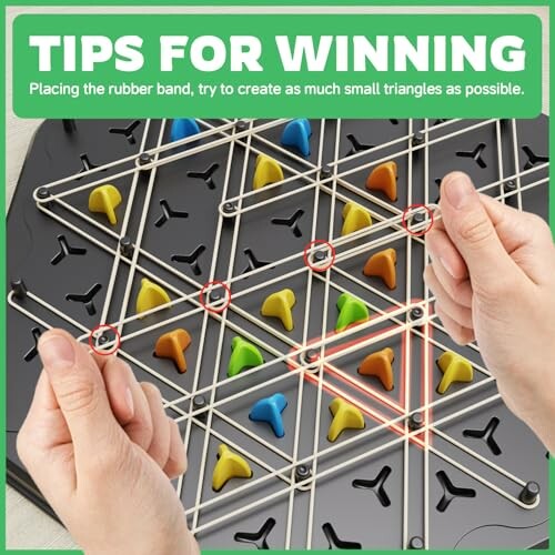 Hands demonstrating strategy game with rubber bands and pegs.