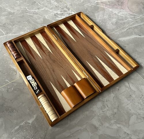 Open wooden backgammon board with dice and checkers.