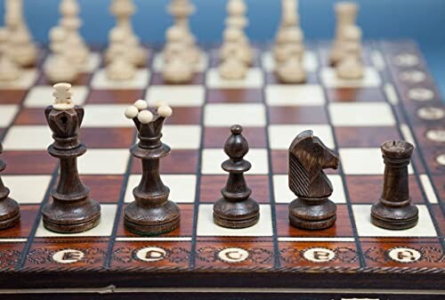 Wooden chess pieces on a chessboard.