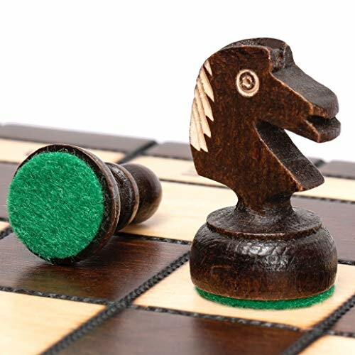 Close-up of wooden chess pieces on a board