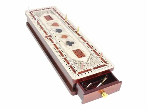 Wooden cribbage board with card suit designs and a small open drawer containing pegs.