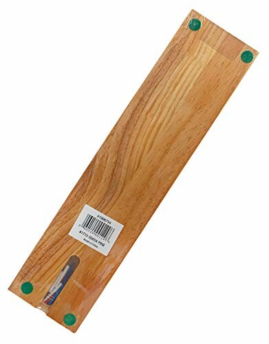 Wooden knife holder with green feet and a barcode.